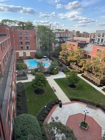 an aerial view of a house with a yard basket ball court and outdoor seating