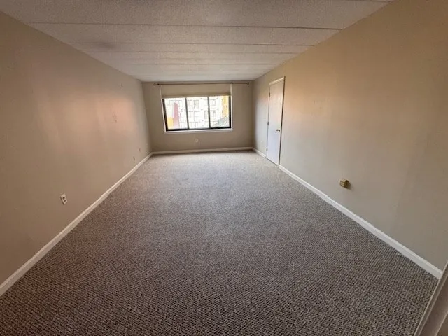 a view of empty room with windows