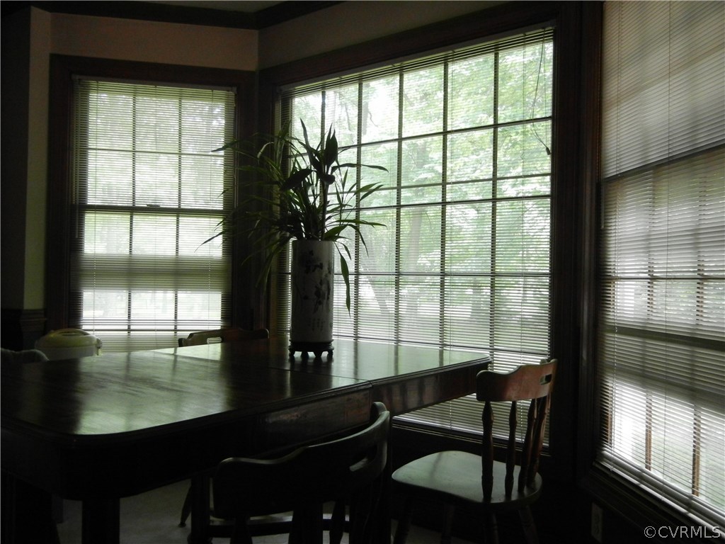 10911 Ramshorn Road Midlothian, VA 23113 - Photo 8 of 8 a dining room with furniture window and wooden floor