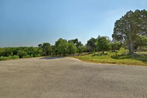 a view of a field with a houses