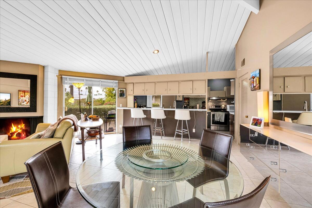 37800 Da Vall Drive, Unit 1 Rancho Mirage, CA 92270 - Photo 11 of 36 a dining room with furniture a table and chairs