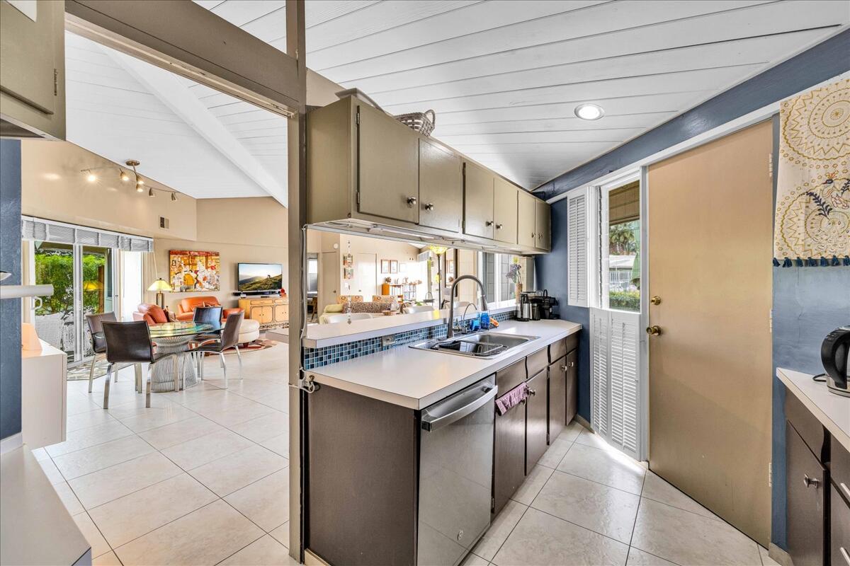 37800 Da Vall Drive, Unit 1 Rancho Mirage, CA 92270 - Photo 13 of 36 a kitchen with a sink and cabinets
