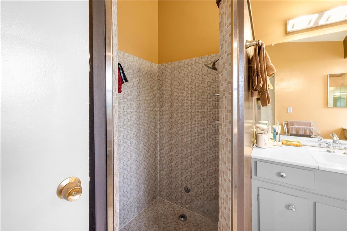 37800 Da Vall Drive, Unit 1 Rancho Mirage, CA 92270 - Photo 20 of 36 a bathroom with a sink and a mirror