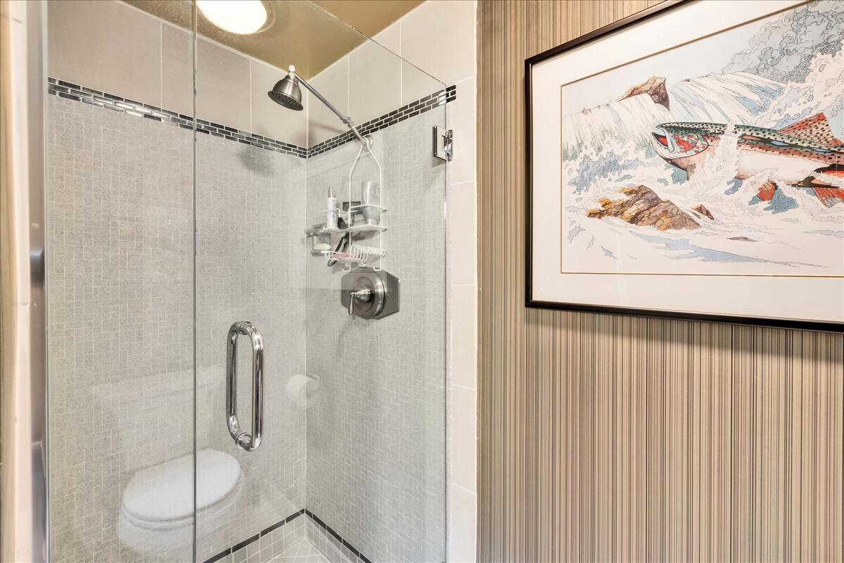37800 Da Vall Drive, Unit 1 Rancho Mirage, CA 92270 - Photo 24 of 36 a bathroom with a shower and a shower curtain