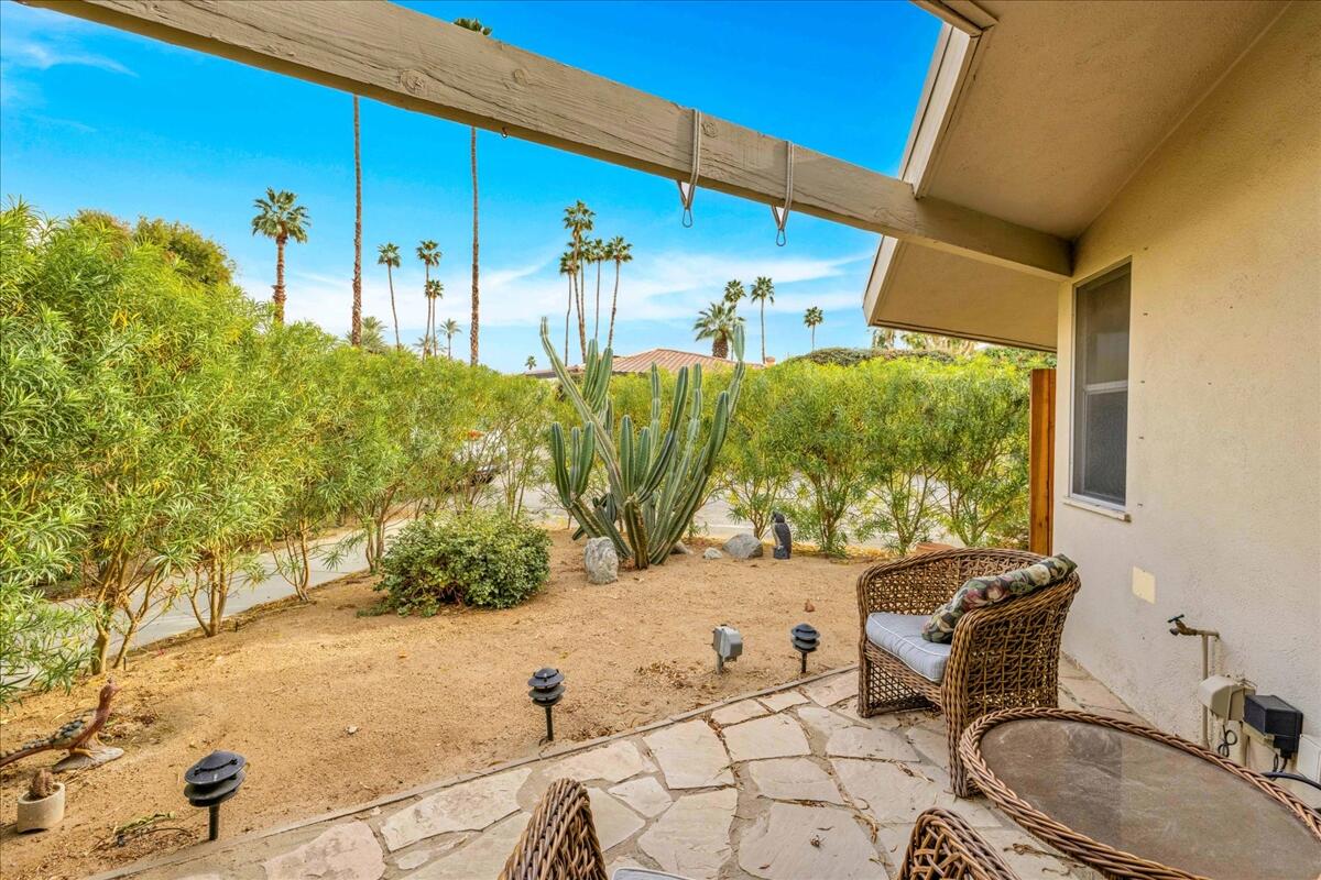 37800 Da Vall Drive, Unit 1 Rancho Mirage, CA 92270 - Photo 25 of 36 a backyard of a house with table and chairs