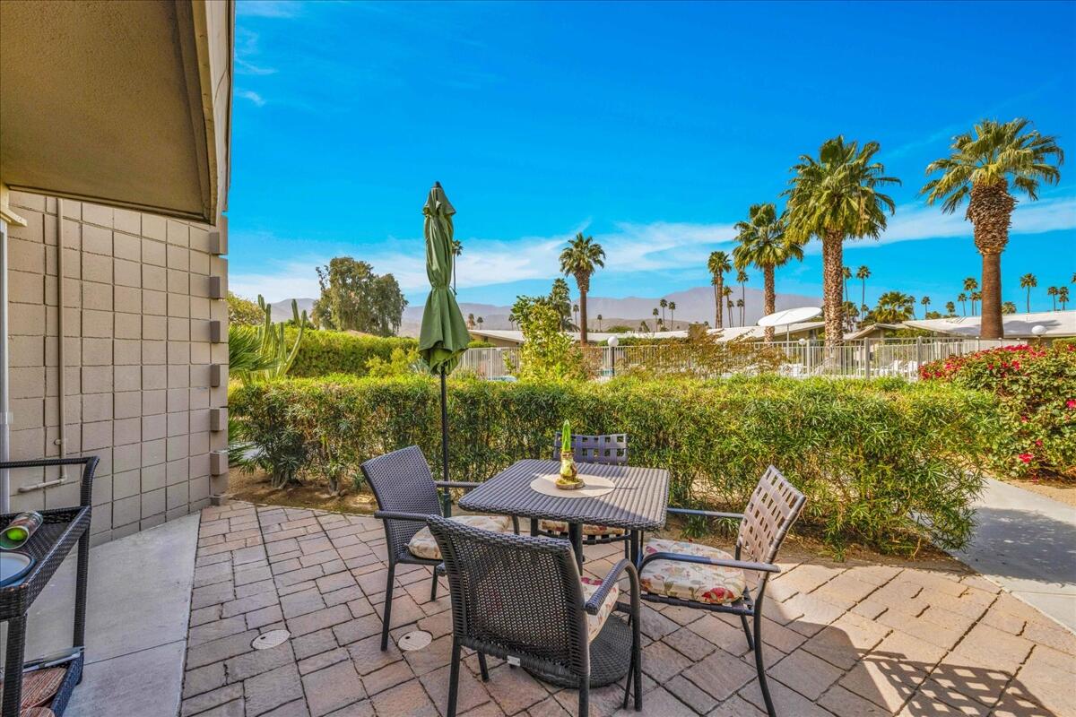 37800 Da Vall Drive, Unit 1 Rancho Mirage, CA 92270 - Photo 26 of 36 a view of a terrace with furniture and a table