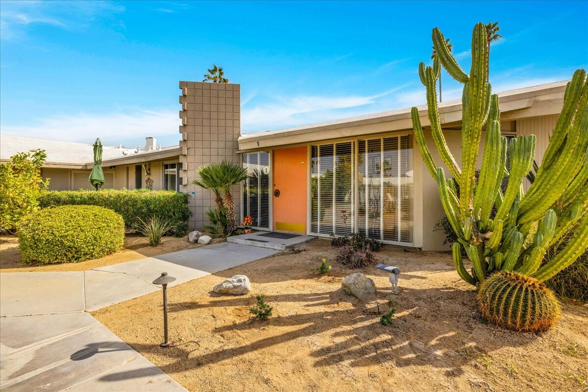 37800 Da Vall Drive, Unit 1 Rancho Mirage, CA 92270 - Photo 4 of 36 a front view of a house with garden