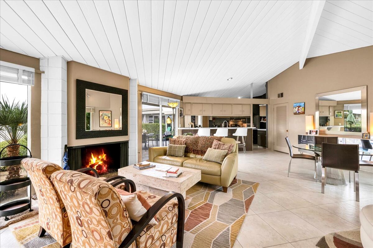 37800 Da Vall Drive, Unit 1 Rancho Mirage, CA 92270 - Photo 8 of 36 a living room with furniture fireplace and a large window