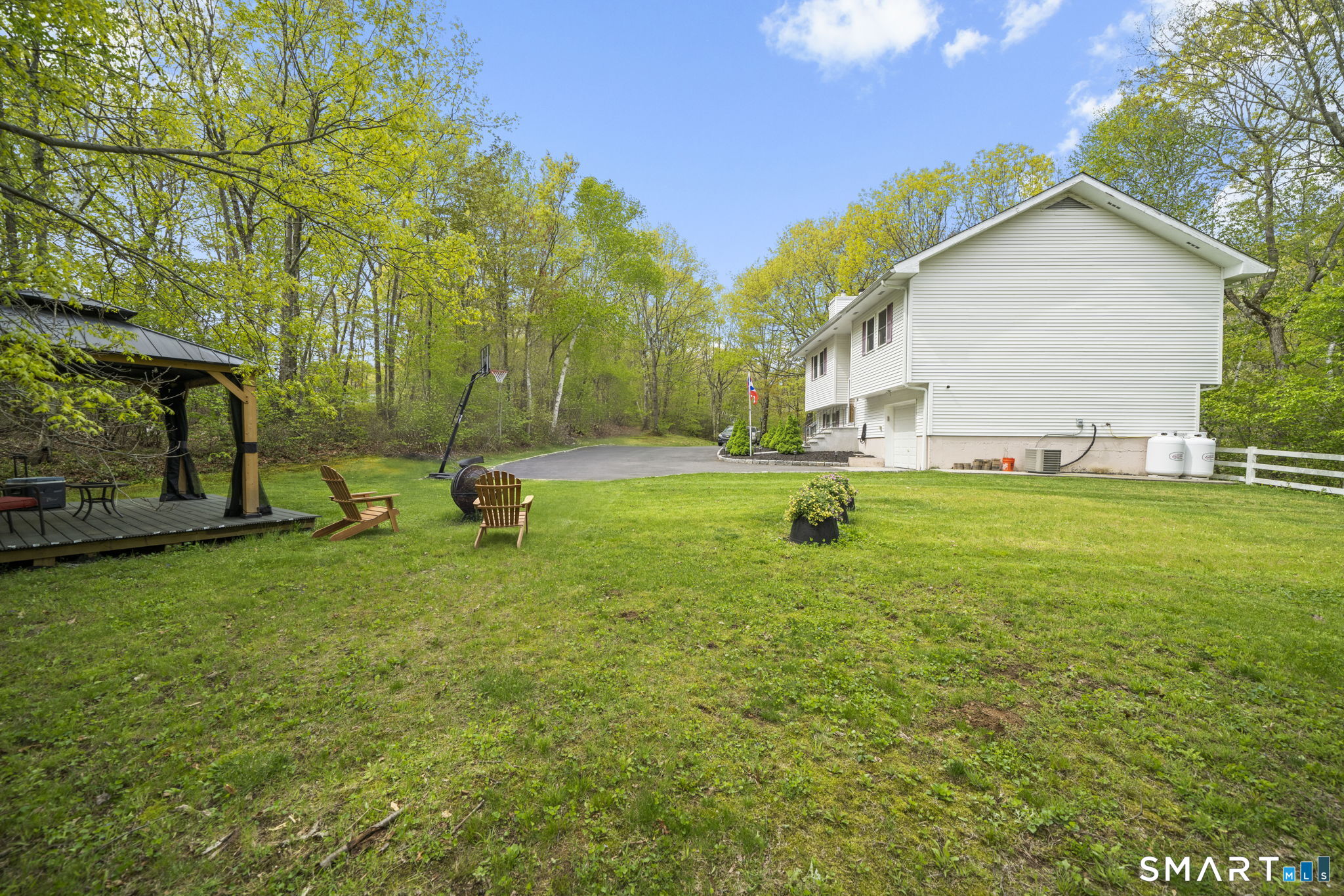 1118 Spindle Hill Road Wolcott, CT 06716 - Photo 36 of 38 a backyard of a house with lots of green space
