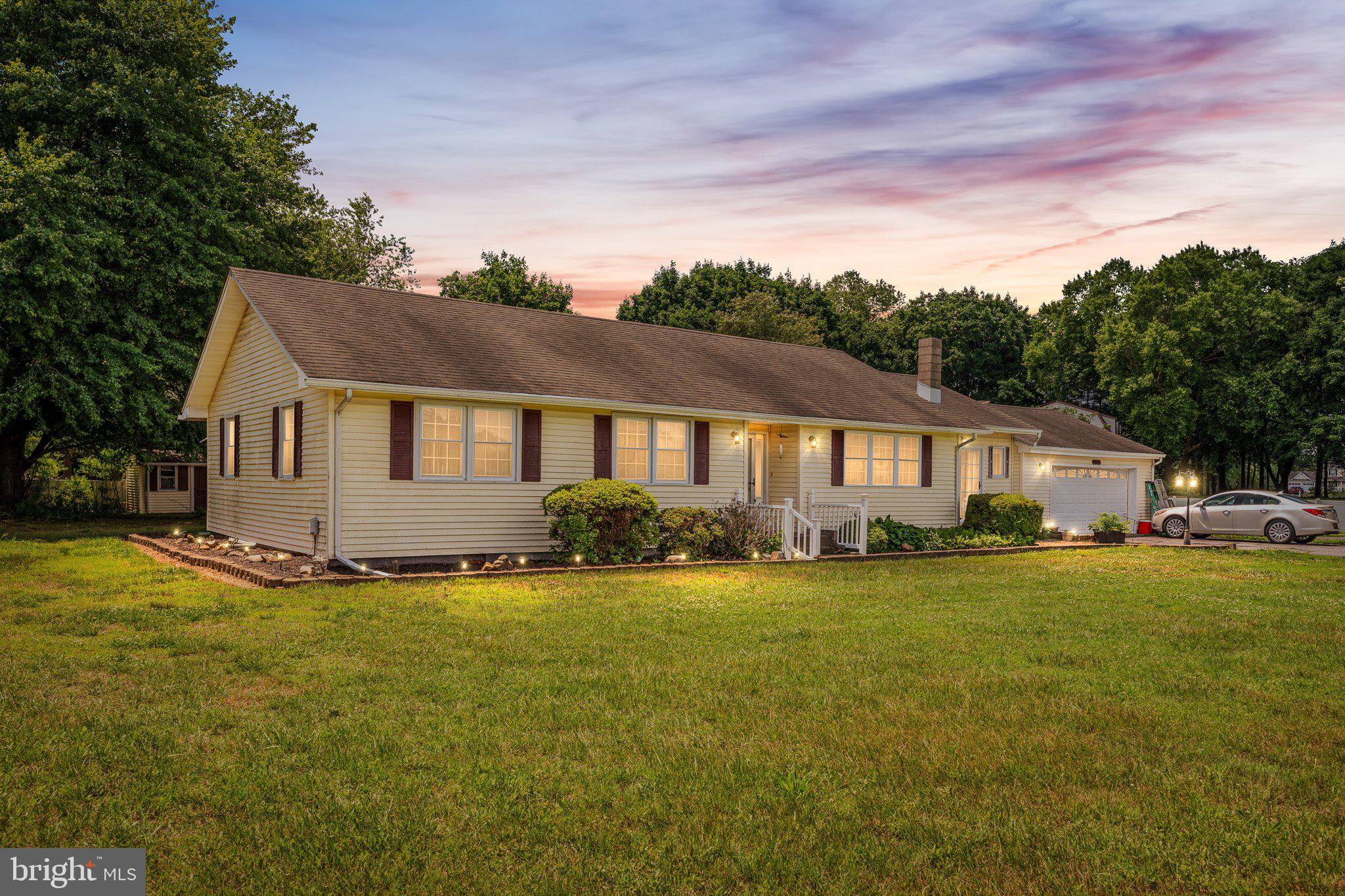 3302 Barratts Chapel Road Frederica, DE 19946 - Photo 2 of 19 a front view of a house with a yard