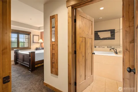 a bathroom with a double vanity sink and mirror