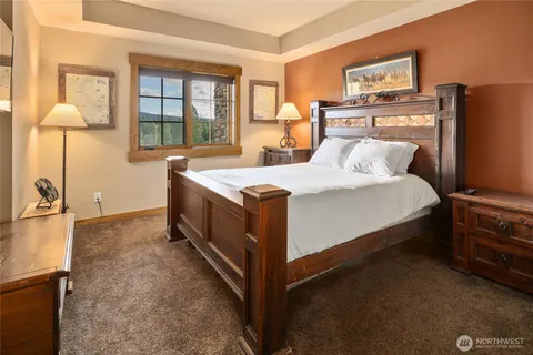a bed room with a bed and a night stand