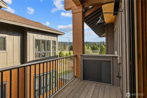 a view of balcony with wooden floor
