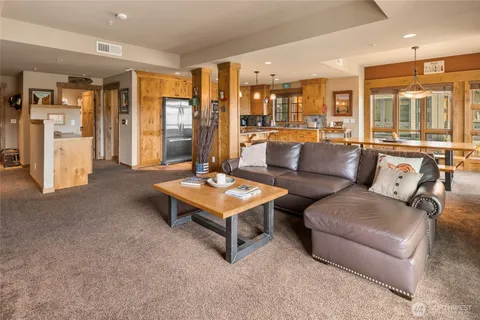 a living room with furniture and a table