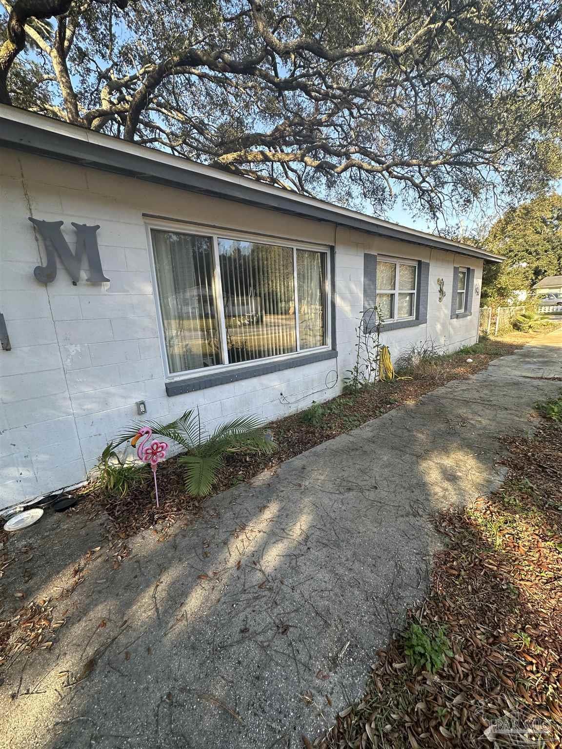 701 East Montclair Road Pensacola, FL 32505 - Photo 2 of 10 a front view of a house with a yard