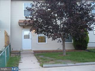 a view of a house with a tree
