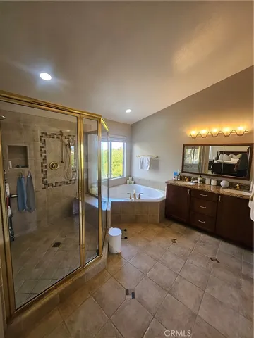 a kitchen with granite countertop a refrigerator and a sink
