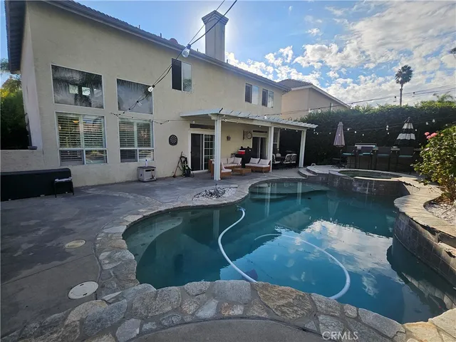 a view of a patio with table and chairs