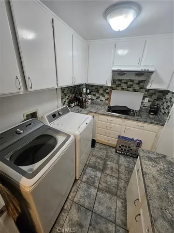 a kitchen that has a sink and a stove
