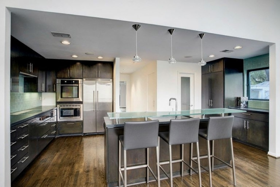1417 Harold Street, Unit B Houston, TX 77006 - Photo 12 of 28 Kitchen breakfast bar shown staged with stools.