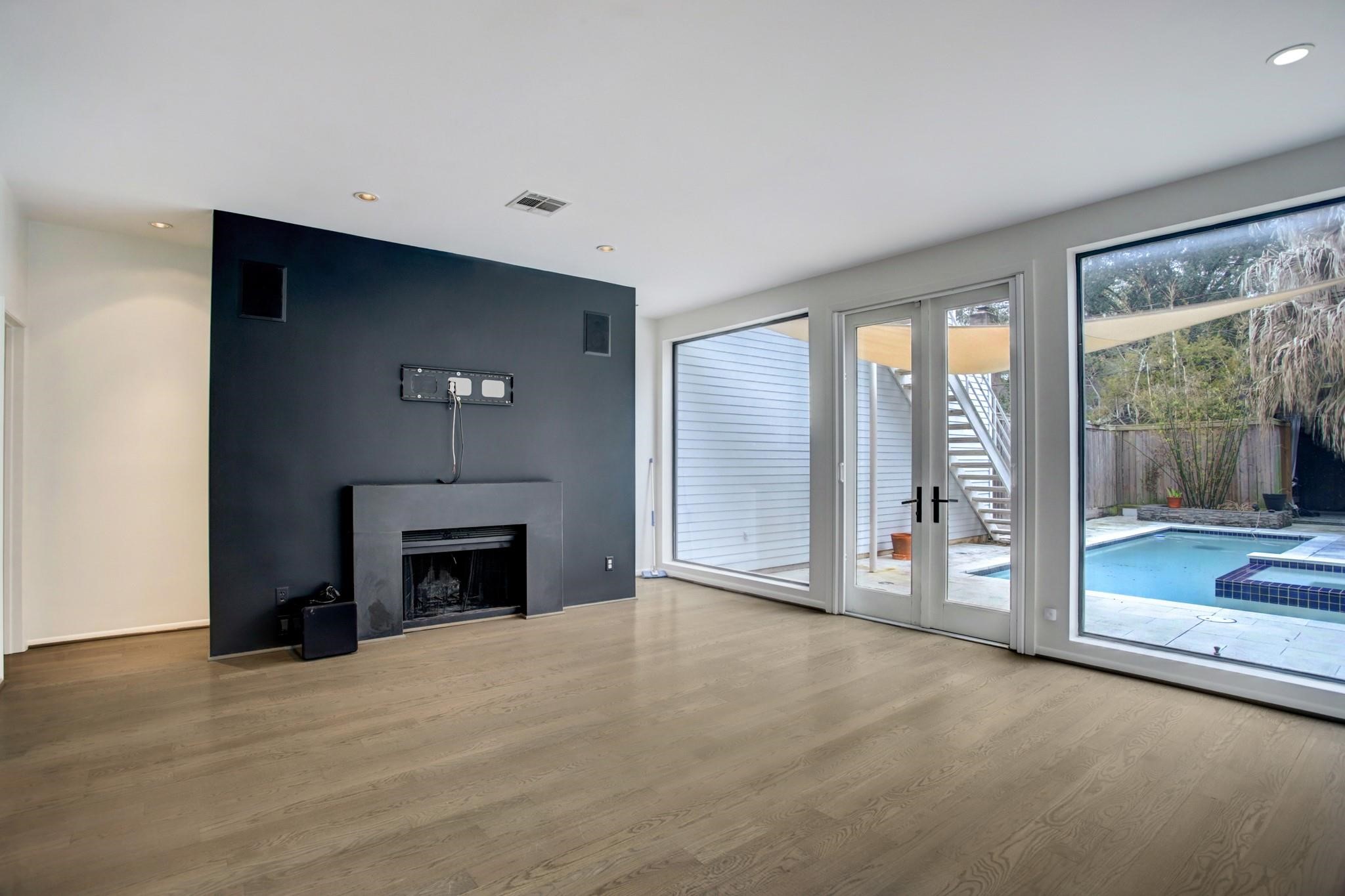 1417 Harold Street, Unit B Houston, TX 77006 - Photo 9 of 28 Wood burning fireplace with modern stone surround.
