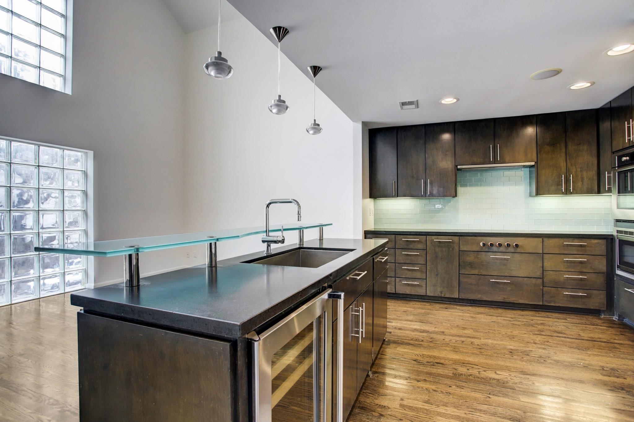 1417 Harold Street, Unit B Houston, TX 77006 - Photo 10 of 28 Gorgeous kitchen with wine fridge and island breakfast bar.