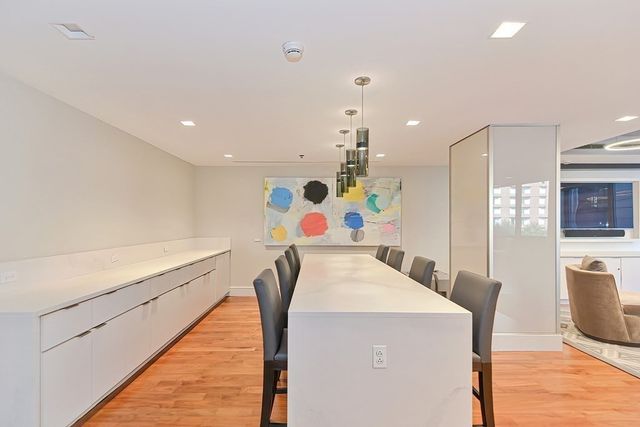 a view of kitchen with furniture and wooden floor