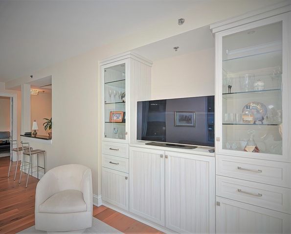 a bathroom with a bathtub and a double vanity sink