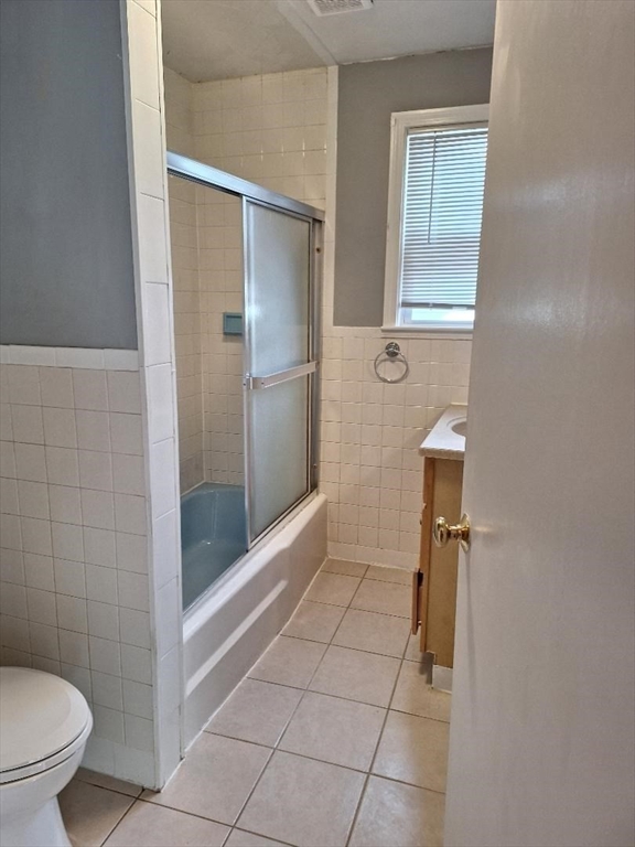 71 Adams Street, Unit 1 Medford, MA 02155 - Photo 4 of 7 a bathroom with a shower and toilet