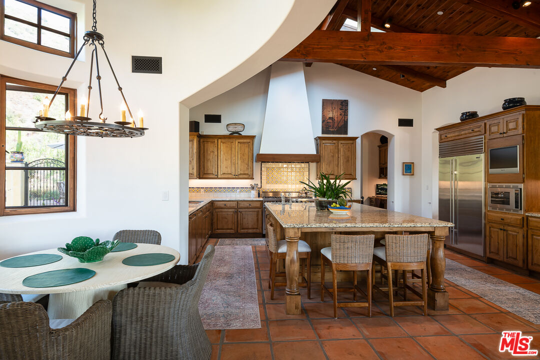 1101 Cold Canyon Road Calabasas, CA 91302 - Photo 13 of 60 a view of a dining room with furniture