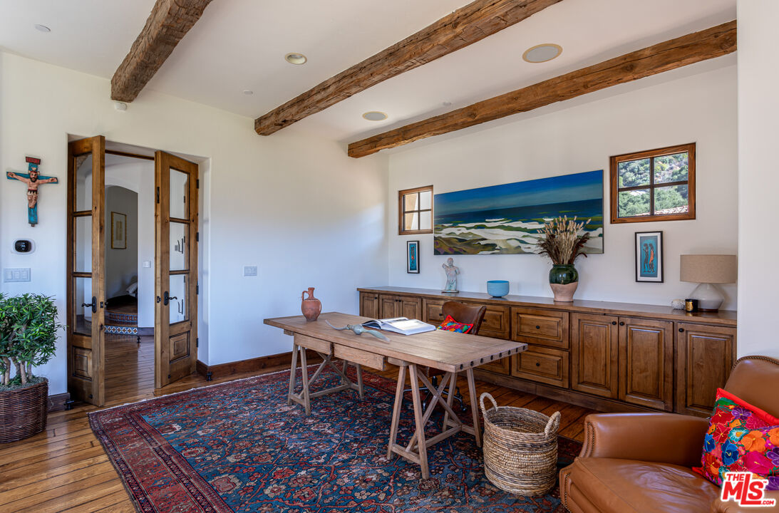 1101 Cold Canyon Road Calabasas, CA 91302 - Photo 30 of 60 a outdoor dining space with furniture and wooden floor