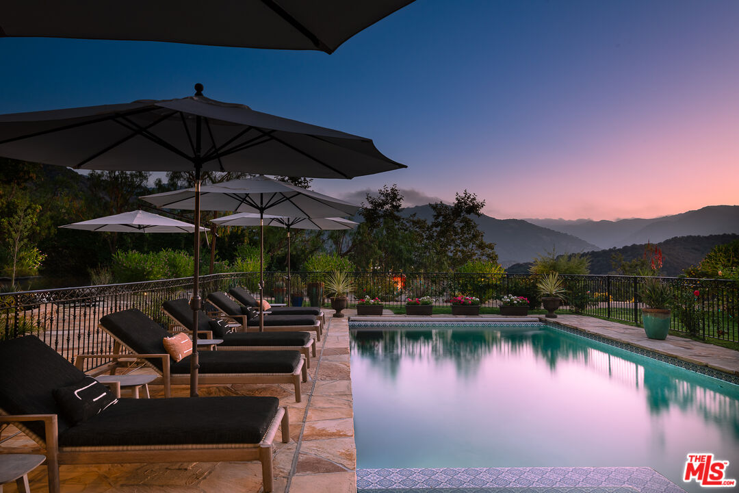 1101 Cold Canyon Road Calabasas, CA 91302 - Photo 46 of 60 a view of a lake with a patio