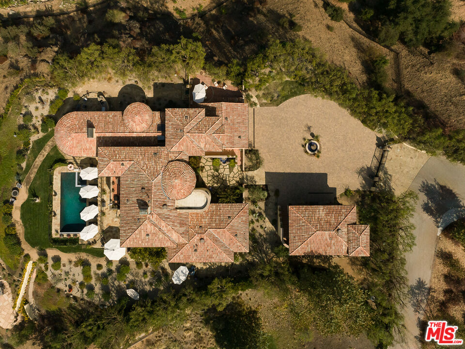 1101 Cold Canyon Road Calabasas, CA 91302 - Photo 57 of 60 an aerial view of a house with a yard
