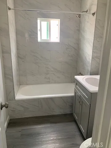 a bathroom with a bathtub a toilet and a shower