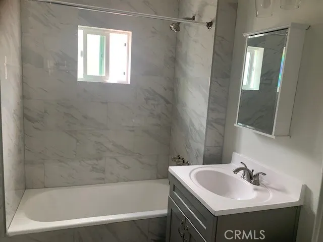 a bathroom with a sink and a bathtub