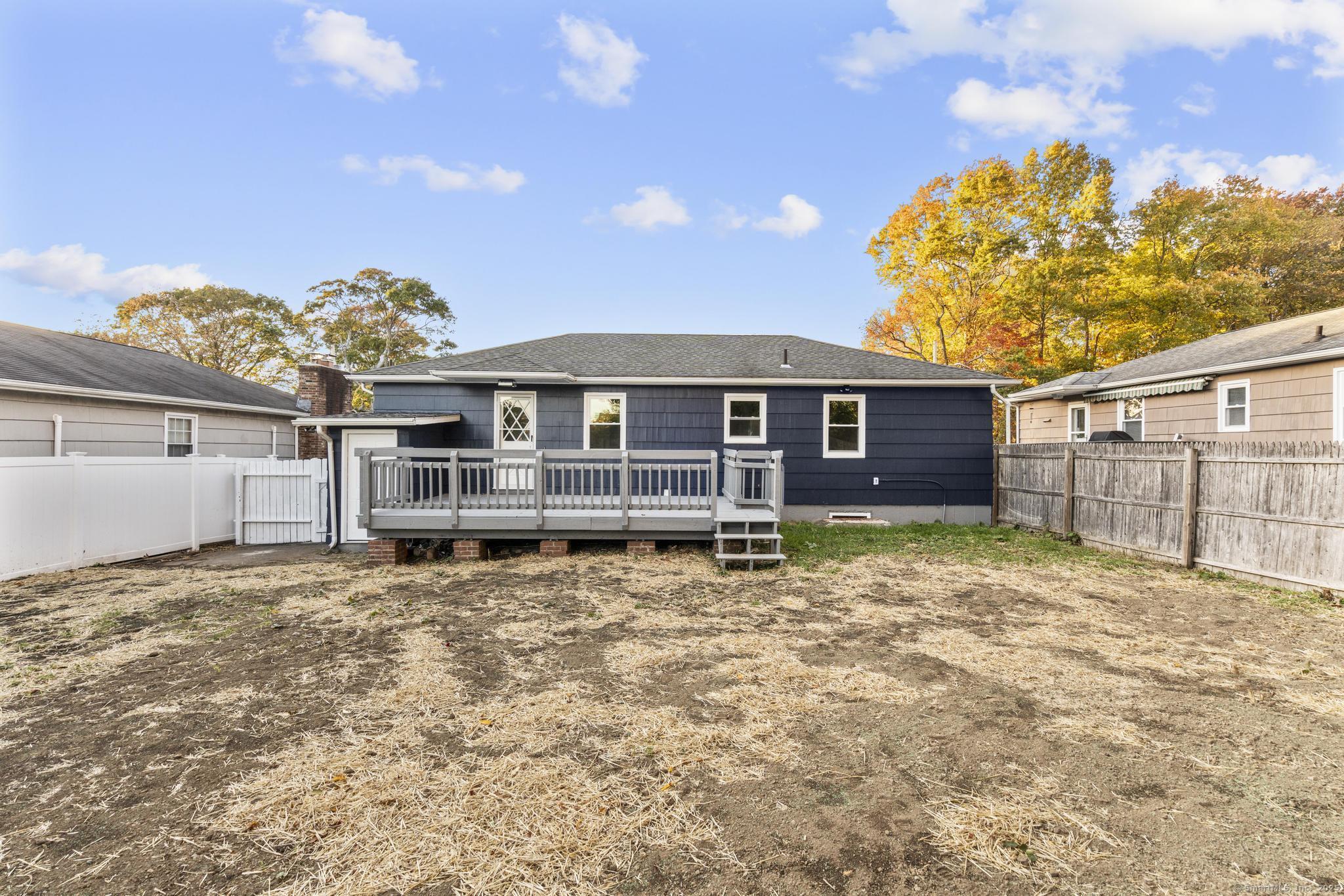 99 Roosevelt Avenue West Haven, CT 06516 - Photo 23 of 27 a large house with a large tree in front of it