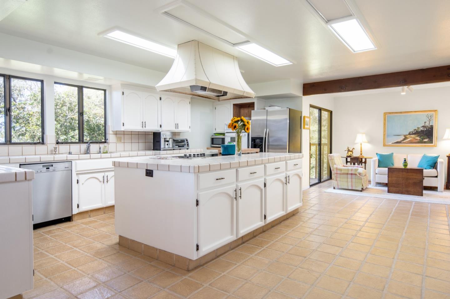 219 Peter Pan Road Carmel, CA 93923 - Photo 13 of 33 a kitchen with white cabinets and white appliances