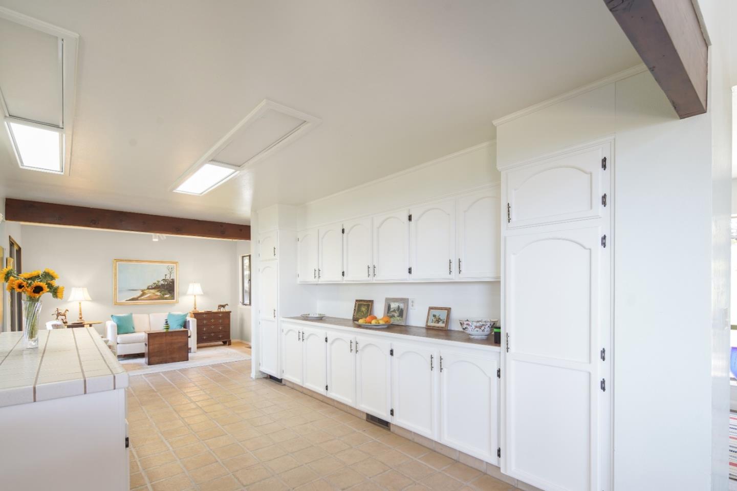 219 Peter Pan Road Carmel, CA 93923 - Photo 14 of 33 a kitchen with cabinets and window