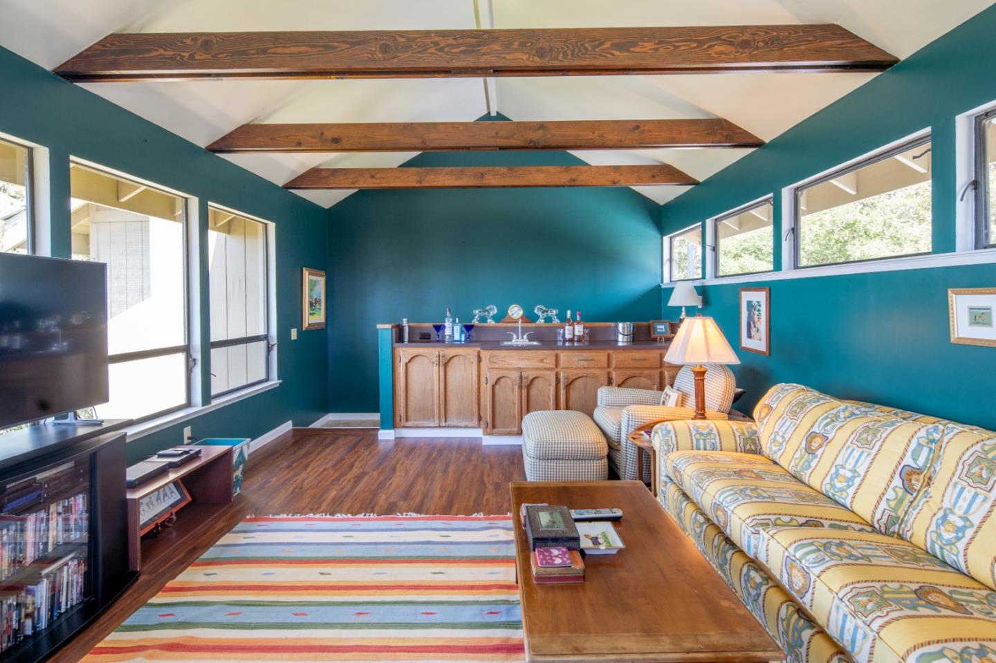 219 Peter Pan Road Carmel, CA 93923 - Photo 20 of 33 a living room with furniture a rug and a chandelier