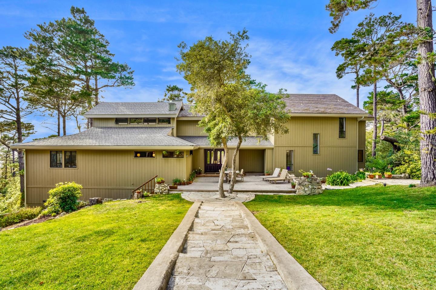 219 Peter Pan Road Carmel, CA 93923 - Photo 2 of 33 a front view of a house with garden