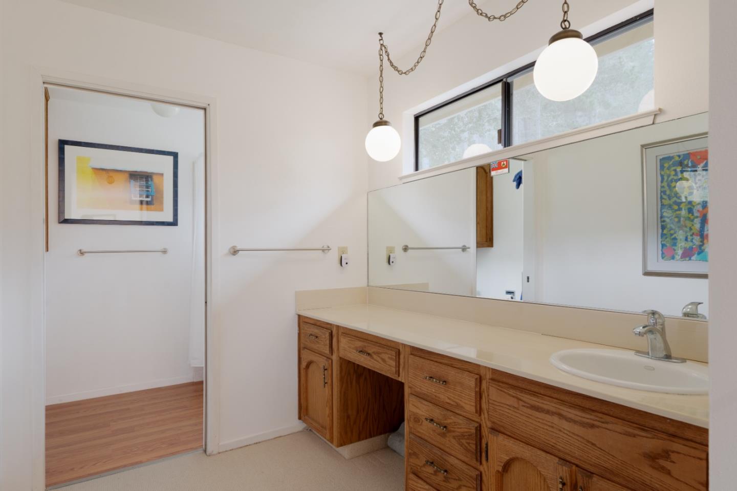 219 Peter Pan Road Carmel, CA 93923 - Photo 24 of 33 a bathroom with a sink and a mirror