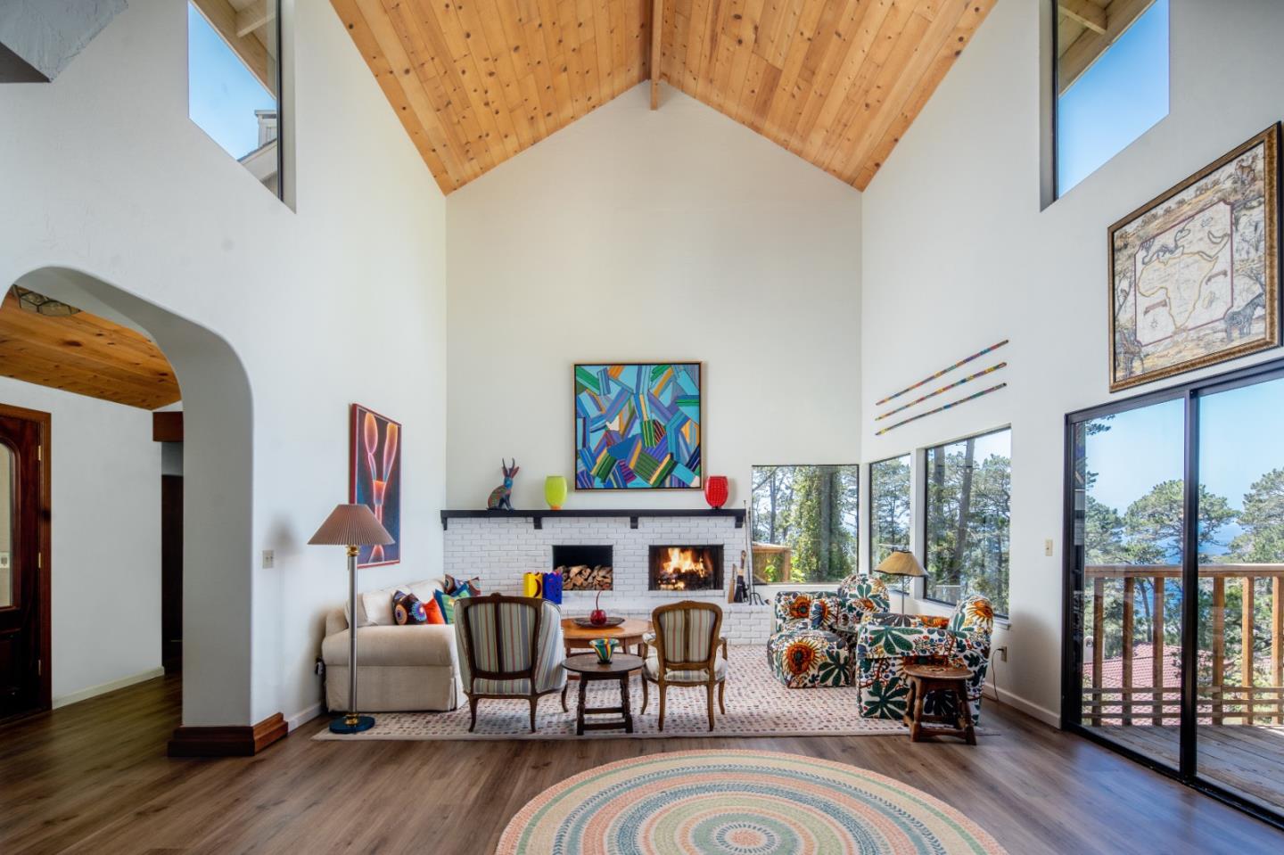 219 Peter Pan Road Carmel, CA 93923 - Photo 7 of 33 a living room with fireplace furniture and a large window