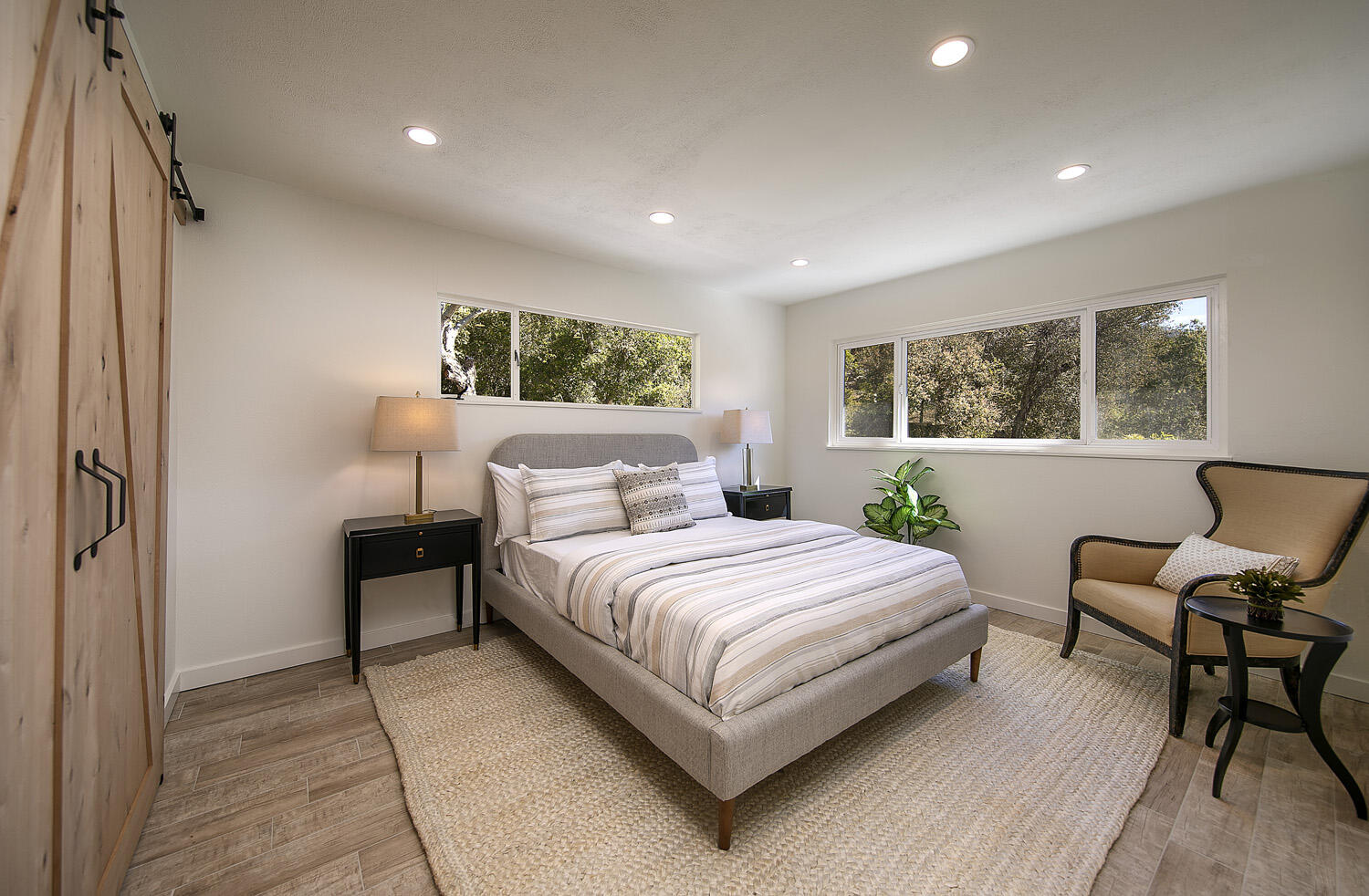 802 Oak Grove Drive Montecito, CA 93108 - Photo 13 of 20 a bedroom with a bed and a chair