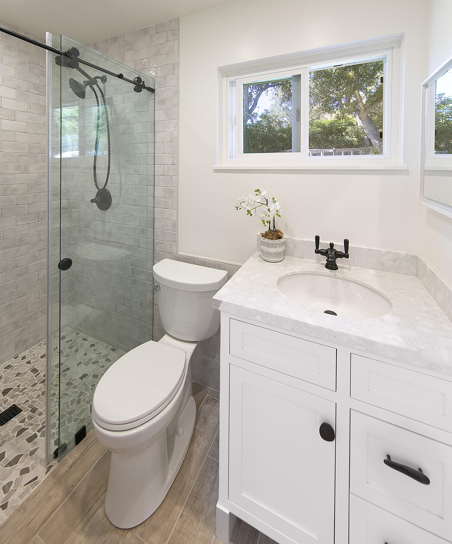 802 Oak Grove Drive Montecito, CA 93108 - Photo 14 of 20 a bathroom with a toilet a sink and a shower