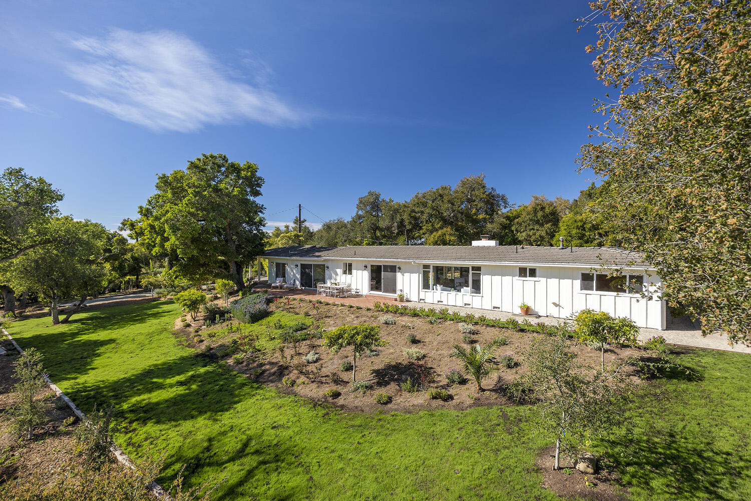 802 Oak Grove Drive Montecito, CA 93108 - Photo 8 of 20 a front view of a house with a garden