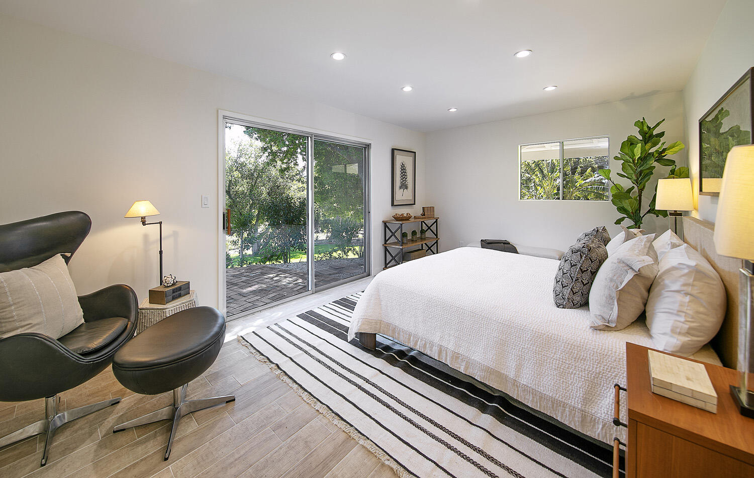 802 Oak Grove Drive Montecito, CA 93108 - Photo 10 of 20 a bedroom with a bed and wooden floor