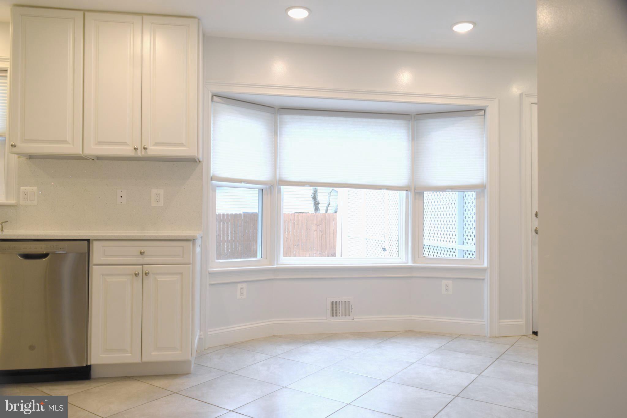 11514 Seven Locks Road Potomac, MD 20854 - Photo 12 of 72 a view of an empty room with a window