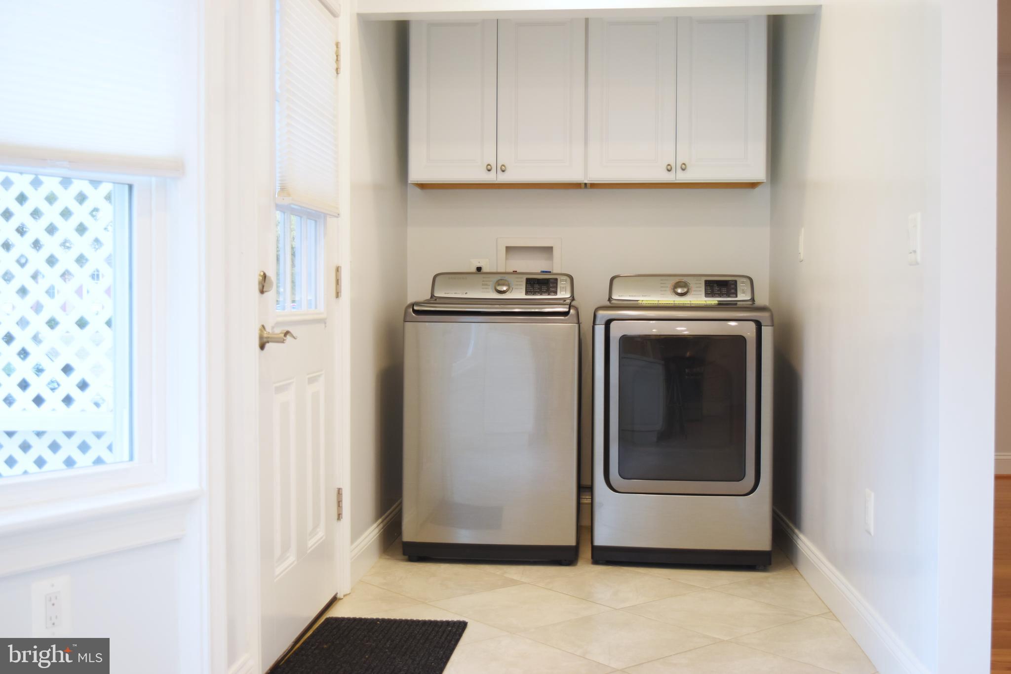 11514 Seven Locks Road Potomac, MD 20854 - Photo 14 of 72 a utility room with dryer and washer
