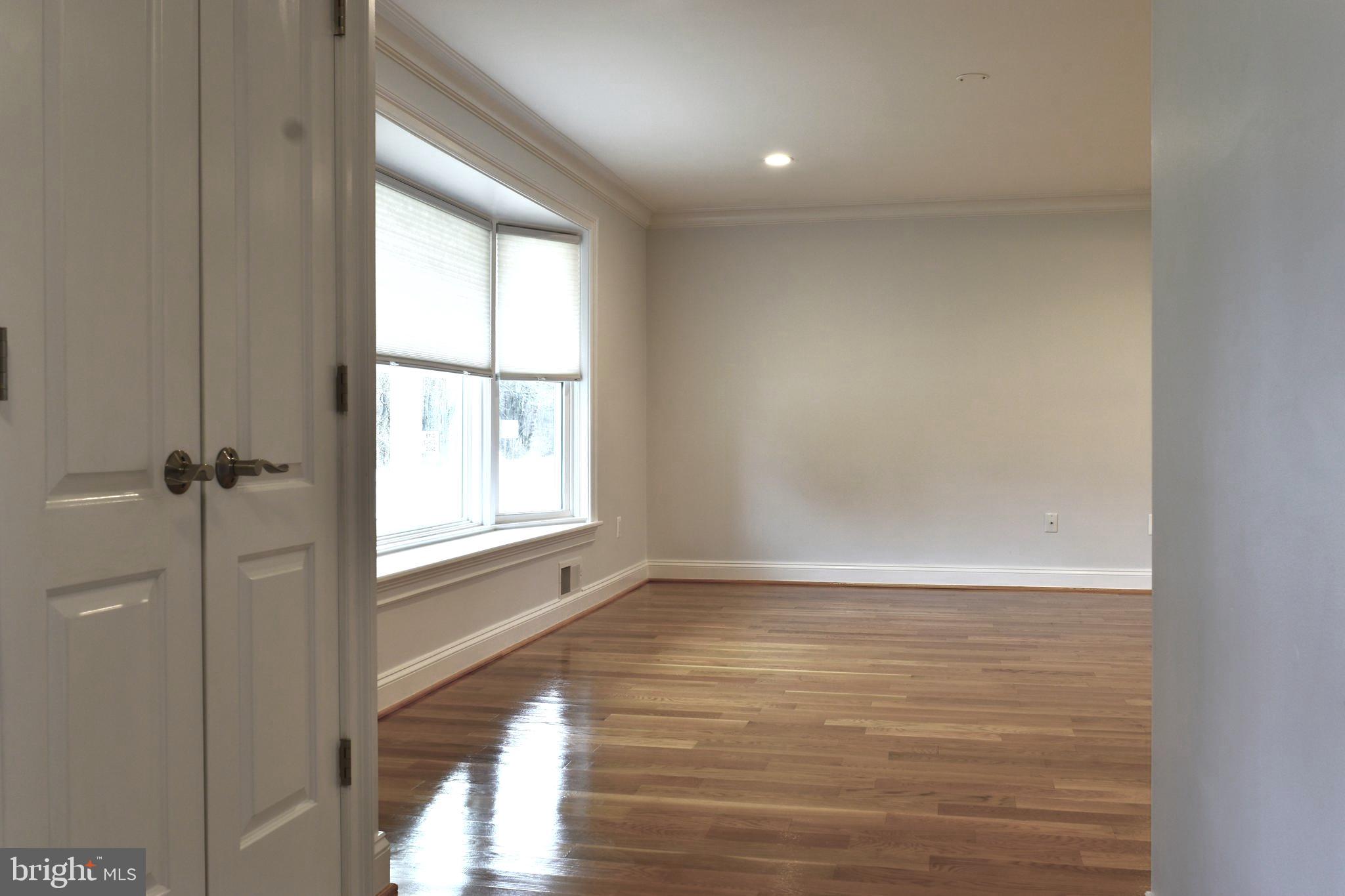 11514 Seven Locks Road Potomac, MD 20854 - Photo 17 of 72 a view of an empty room with a window