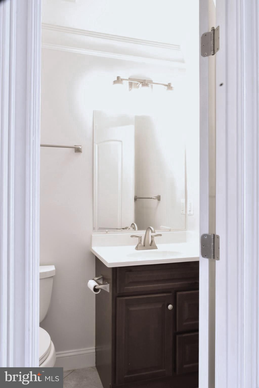 11514 Seven Locks Road Potomac, MD 20854 - Photo 24 of 72 a bathroom with a sink and a mirror